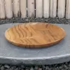 Product image 1 of the product “Wooden plate, made of teak wood, 25 cm dia. ”